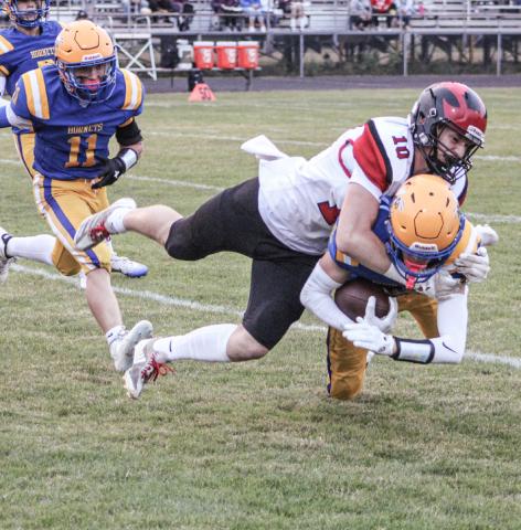 Beaverton’s Ian Roberts puts a stop to the forward progress of a Harrison ball-carrier Friday night. The Beavers fell to 2-2 on the season with a 36-20 loss.