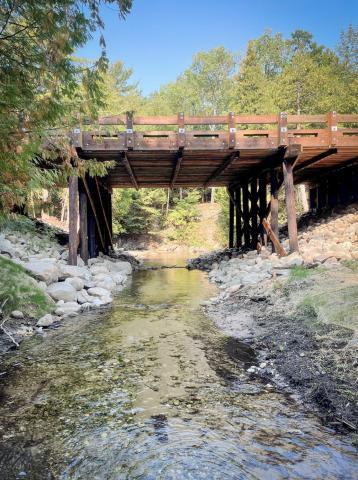 Wycamp Creek Road-Stream Crossing was replaced with a new timber bridge in September 2024, reconnecting 1.35 miles of stream for white and longnose suckers, culturally significant fish species for Little Traverse Bay Band of Odawa Indians. (Photo courtesy Little Traverse Bay Band of Odawa Indians)