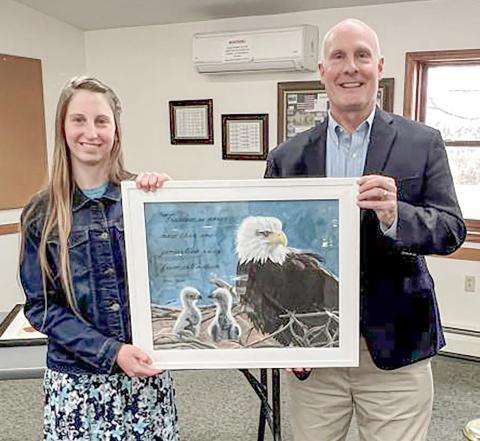 Congressman John Moolenaar and Nevada Draper, the winner of the 2025 Congressional Art Competition for Michigan’s Second District, and her painting, “One Generation Away.”