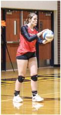 Kaelyn Fischer gets ready to serve against Shepherd.