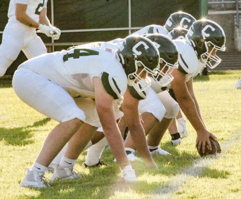 The Clare offensive line is ready for the snap Thursday night during the Pioneers victory at Grayling.