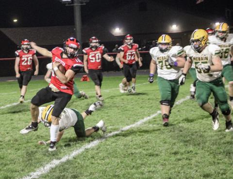 Beaverton’s offense attempts to get through McBain last Friday during the Division 7 district championship game.