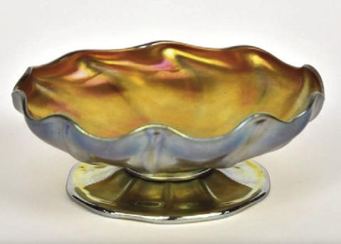 To a bottle collector, iridescence is a kind of damage. In the world of art glass, especially Tiffany’s, it’s an extremely desirable decoration.