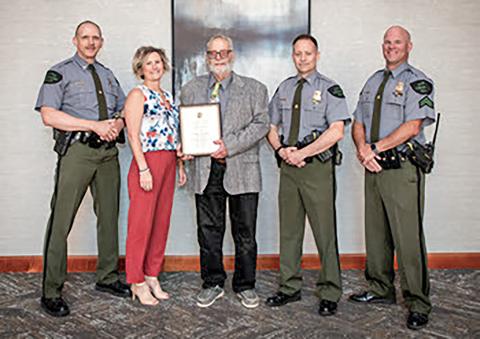 Dale Hendershot of Gladwin was honored as the Michigan Department of Natural Resources 2024 Hunter Education Instructor of the Year. Hendershot has been a volunteer hunter safety education instructor for more than 34 years. Pictured, left to right are Chief Jason Haines, DNR Law Enforcement Division; Erica Moore, DNR department specialist; Hendershot; Lt. Tom Wanless and Cpl. Ken Lowell, both with the DNR Law Enforcement Division.