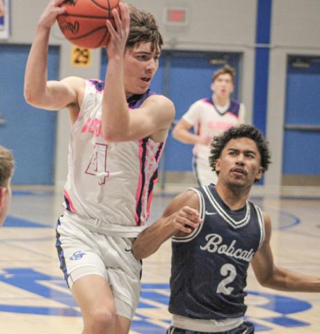 Gladwin’s Ben Verellen crashes into the paint during last week’s victory over visiting Bay City John Glenn on Coaches Vs. Cancer Night.