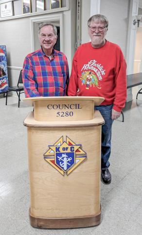 Pictured is Al von Matt (right) and Monsignor Koper (left), both are Knights of Columbus members. The podium in the picture was crafted by Al Von Mott and he donated it to Knights of Columbus, Gladwin Council 5280.