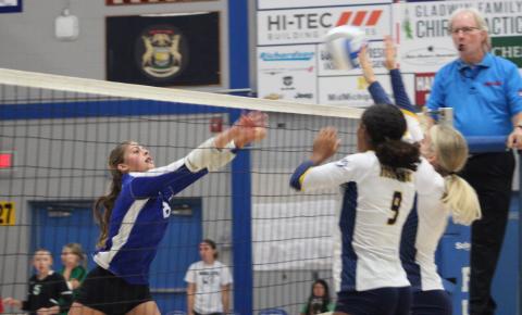 Gladwin’s Maddy Pagel tries to shoot one through the block during a match earlier this season.