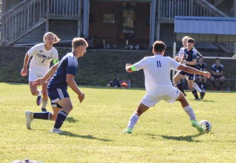 Pictured is player #7 Treyton Siegert, and #11 Andrew Von matt moving upfield against Roscommon.