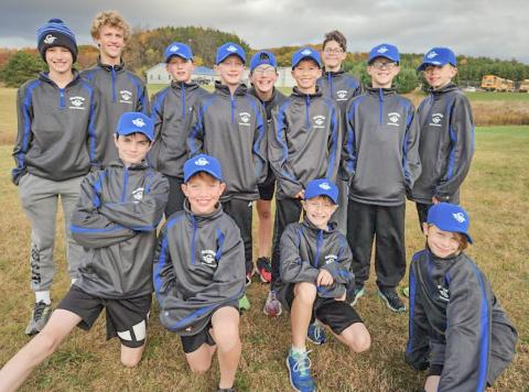 The boys before the meet in their warm up jackets and hats donated to the team by Mr. Kurt Hansen. The team would like to thank Mr. Hansen for his donation.