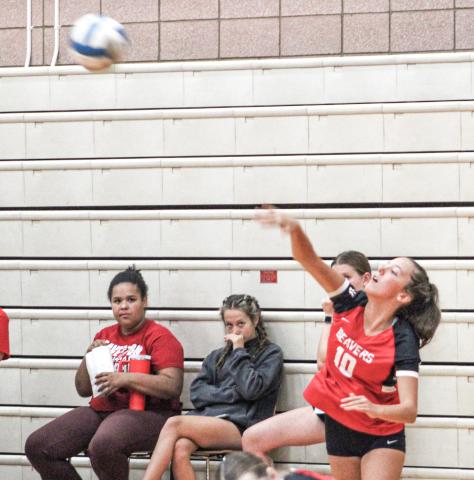 Beaverton’s Piper Carland serves up an ace last Wednesday night as the Beavers took two matches out of three in a quadrangular meet.