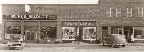 This building complex still stands on the south side of Cedar between Townsend and Silverleaf streets. The roof has been completely reconstructed and it has been remodeled several times since then. This building replaced previous structures that had been destroyed by a fire that destroyed most of the commercial block in 1936. Another fire in 1947 prompted the first major remodeling of this building.