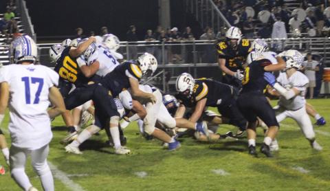 Gladwin’s Preston Willert plows through the middle of the Shepherd defense, which was pretty much his job description, during Friday night’s 25-14 victory.