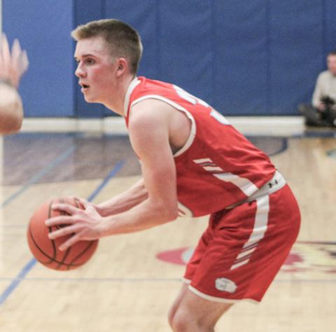 Beaverton’s Layk Woodruff looks for an open teammate. Woodruff scored 22 points in a 7022 victory at Shepherd Thursday night.