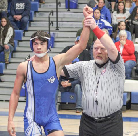 Cruz Balcirak is declared the winner Wednesday night while helping Gladwin to a pair of Jack Pine Conference dual meet victories.