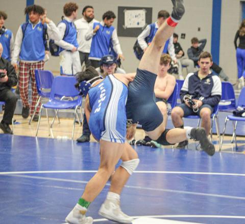 Gladwin’s Cruz Balcirak takes a Traverse City St. Francis opponent for a ride on his way to a 10-2 major decision at 132 during the team tournament hosted by the Flying G’s Saturday.