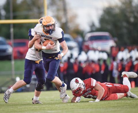 Joe Bellor takes the hand-off and looks for running room during Standish-Sterling’s 53-14 loss at Millington Friday night. PHOTOS COURTESY OF MINDY STOKOSZYNSKI
