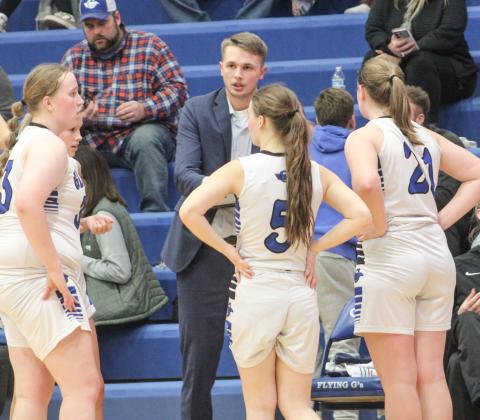 Gladwin Coach Nic Taratuta instructing the team on a play.