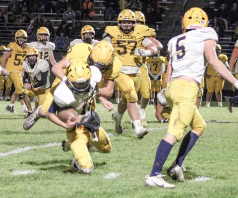 Ogemaw Heights’ Jackson Ziegler crushes the quarterback for a sack during Friday night’s overtime victory over Negaunee in the first round of the Division 5 playoffs.