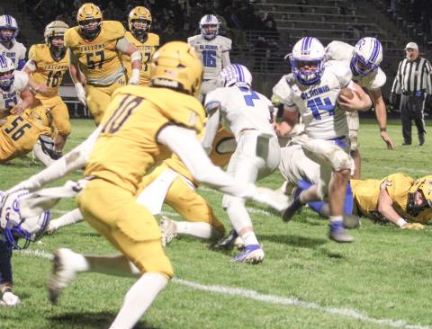 Preston Willert races out of the backfield during Gladwin’s 28-19 victory at Ogemaw Heights Friday night in the second round of the Division 5 playoffs.