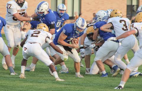 Ogemaw Heights’ Elijah Smith gets into position to tackle Gladwin quarterback Colton Pfenninger during Friday night’s victory for the Falcons. COURTNEY VERELLEN