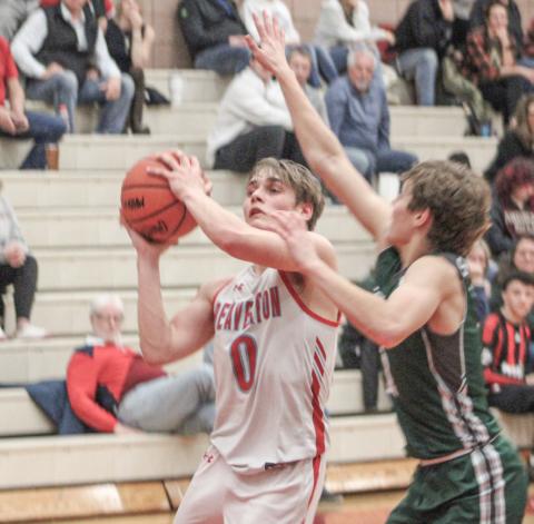 Beaverton’s Caiden Loar takes the contact on a drive to the basket during last week’s district semifinal loss to Pinconning.