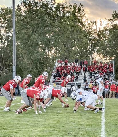 The Gladwin defense digs in prior to the snap on a rough night at Spring Lake. The Flying G’s will shoot for their first win Friday night when they host Jack Pine Conference rival Ogemaw Heights.