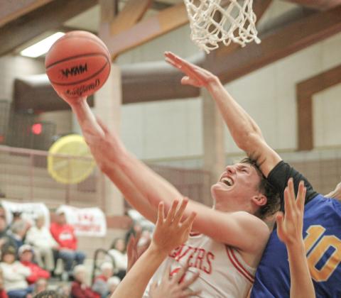 Beaverton’s Ian Roberts takes the heat on the way to the hoop Friday night in a 74-43 victory over visiting Harrison.