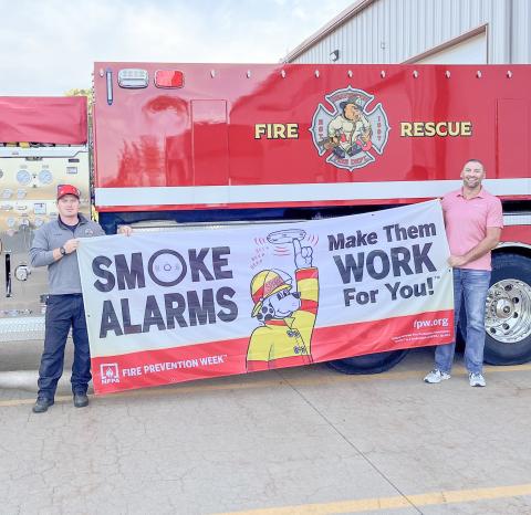 Pictured are Phil Andrist and Brent Mishler promoting Fire Prevention Week.