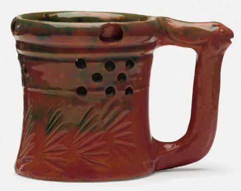George E. Ohr’s pottery can be recognized by its thin clay, vividly colored glaze and an overall sense of eccentricity.