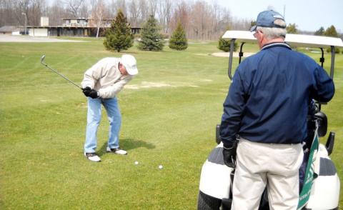 Pat Boruszewski, of Gladwin, took a shot at the opening of Sam’s Scramble on April 15, 2011, Gladwin Heights Golf Course, while threesome partner, Paul Ninelist, of Beaverton, looked on. Sam’s Scramble has taken place for many years.