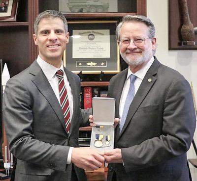 Pictured left to right are Thomas Mancinelli and Gary Peters.