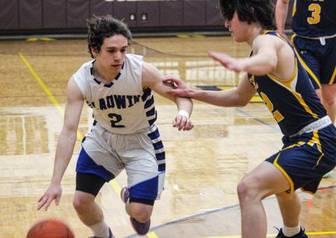 Brady Gehrett works his way around a Standish-Sterling defender.