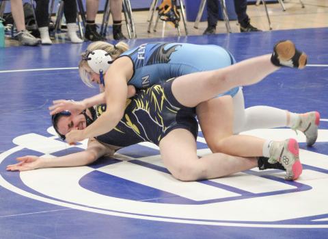 Gladwin’s Lily Miller battled to a second-place finish at 135 at the individual district tournament Sunday to qualify for this weekend’s regional.