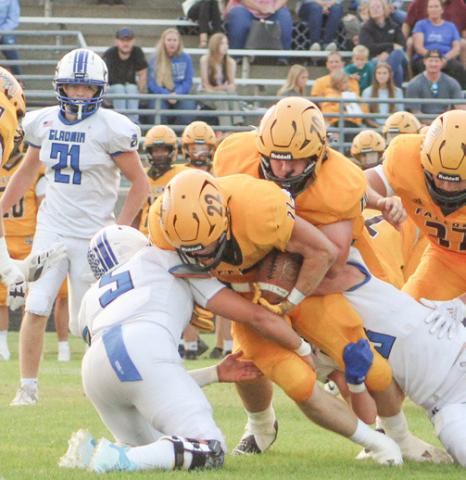 Returning Ogemaw Heights senior running back Connor Lambert draws a crowd during last year’s match-up with Gladwin.