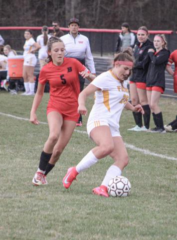 Beaverton’s Piper Carland battles for the ball with an Ogemaw Heights defender last week.