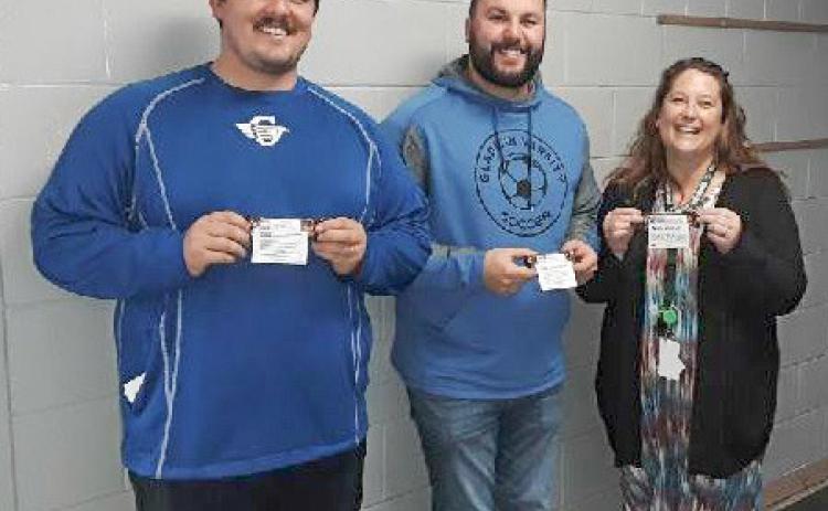 Gladwin Intermediate School teachers, Ethan Gary, Dominic Lake, and Sofia Kruske, hold the candy bars of appreciation they received from MARSP-Gladwin County Chapter.