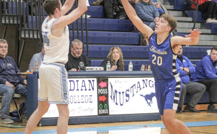 Gladwin’s Brody Verellen applies defensive pressure during last Wednesday’s season-opener at Meridian.