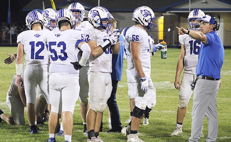 Kody Emeott calls the shots during a time out last season. Emeott has moved up from Defensive Coordinator to Head Coach and will lead the Flying G’s for the first time Friday night at Flat Rock.