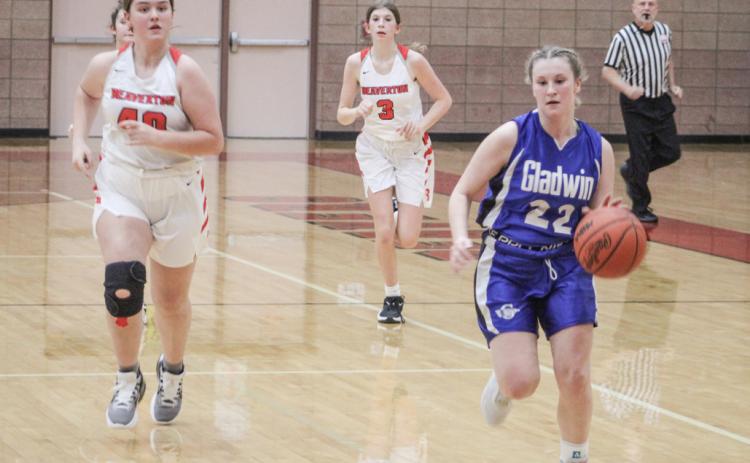 Gladwin’s Elizabeth Winchester runs the floor during the Flying G’s junior varsity victory Thursday night.