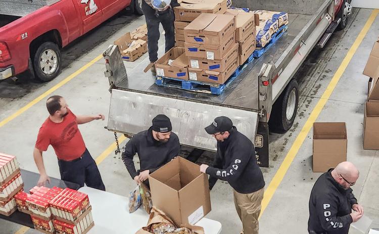 Volunteers at the seventh annual Thanksgiving Dinner Giveaway event at the Beaverton Area Fire Department.
