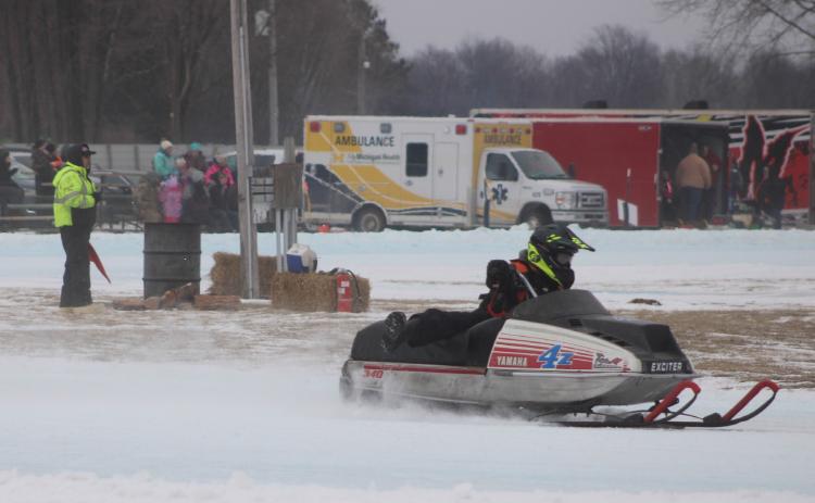 Harvey Zelt roars into a turn during the recent Vintage Snowmobile Race at the Gladwin County Fairgrounds.