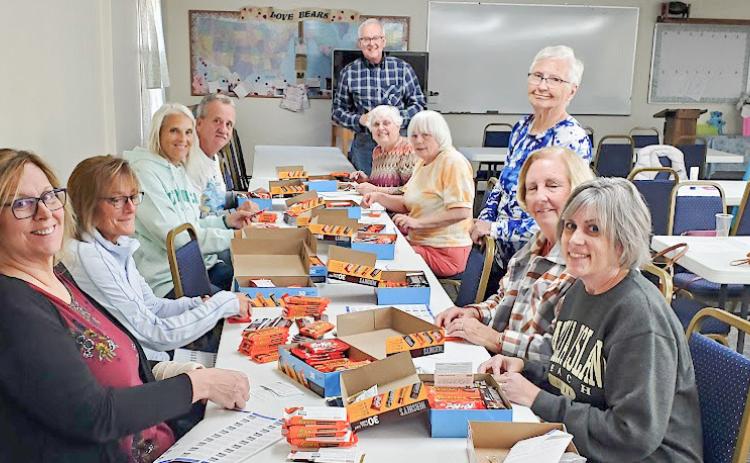 MARSP-Gladwin County Chapter volunteers participate in a work-bee to prepare candy bars to distribute in appreciation to Gladwin and Beaverton School staff.