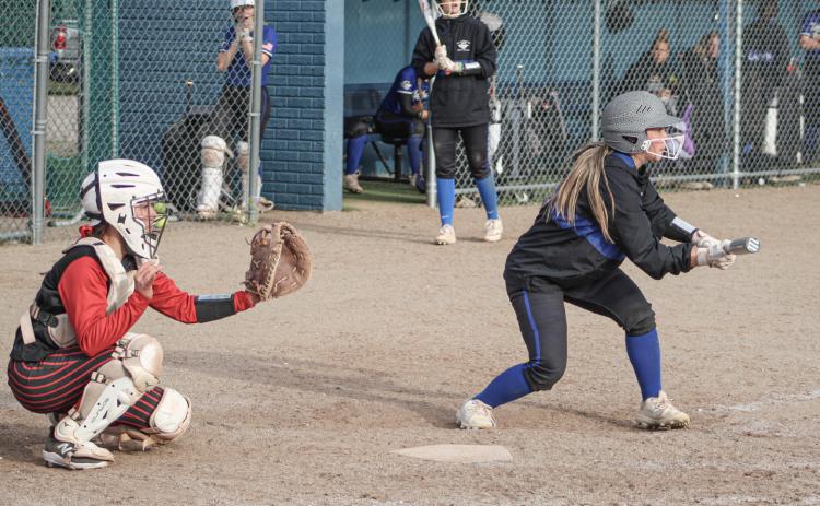 The bunt sign is on for Gladwin batter Addison Tyslicki during last week’s doubleheader sweep at the hands of visiting St. Louis.
