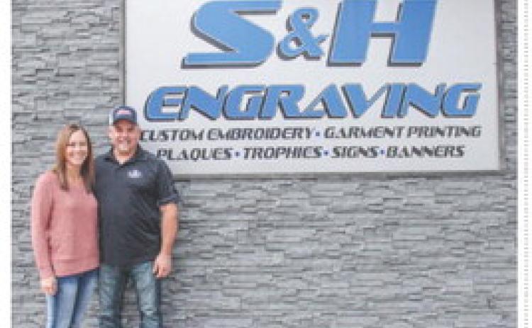Mike and Stephanie Hess pictured in front of S&amp;H Engraving located at 202 E. Cedar Avenue in Gladwin.