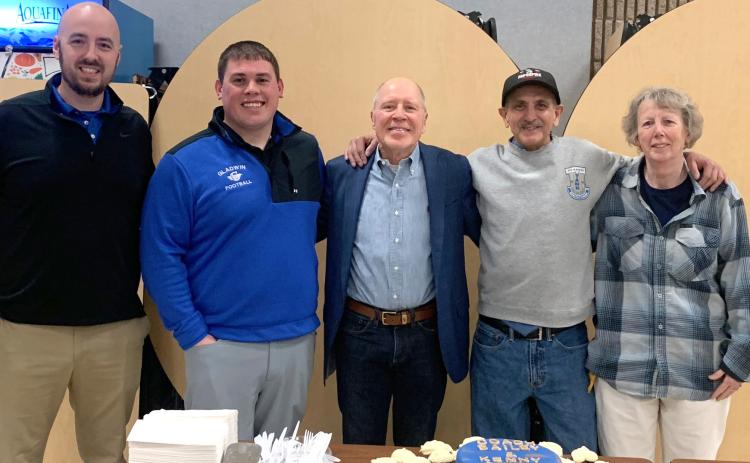 Pictured left to right are: current football coach, Marc Jarstfer; defensive coach; Kody Emeott, Mike Bailey, Kenny Owens, and Ruth Ann Joslin.