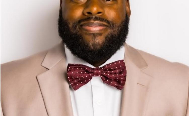 Lewis named champion of  “100 Men and More” Campaign