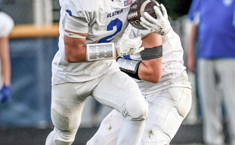Gladwin’s MJ McDonald looks for running room. MINDY STOKOSZYNSKI