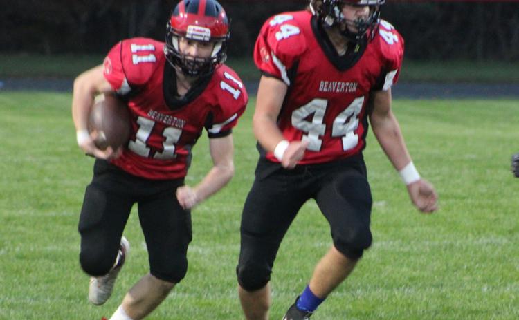 Beaverton junior varsity running back Caden Snyder follows blocker Ben Zdrojewski during a recent game. The Beavers finished the season with a comeback victory over Morley Stanwood.