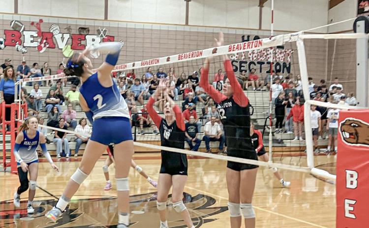 Beaverton’s Taryn Roberts (left) and Trinity Danielak defend the net during last week’s season-opener against visiting Beal City.