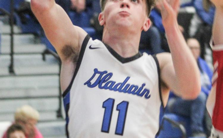 Gladwin’s Trace Corlew grabs a rebound during a recent game.